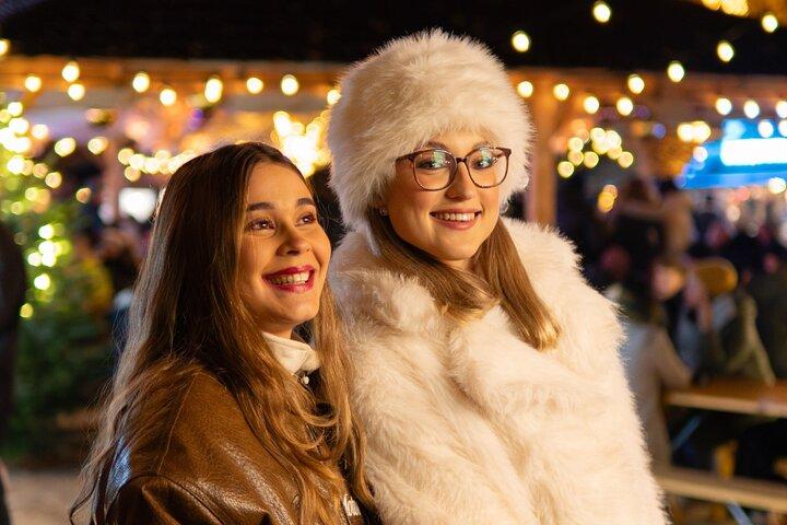 Skaters holding hands at the Lucerne ice rink