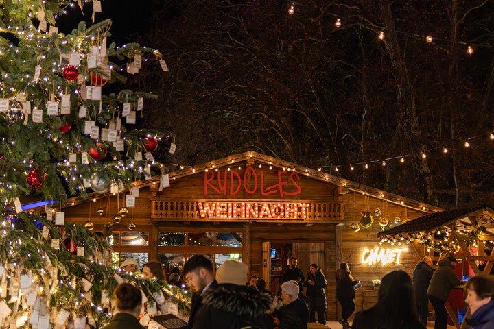 Christmas tree and wooden chalets at the market