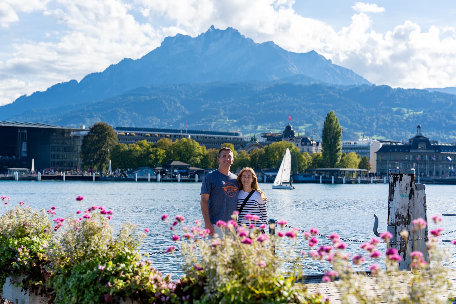 Couple on the lakefront promenade with Mount Pilatus behind