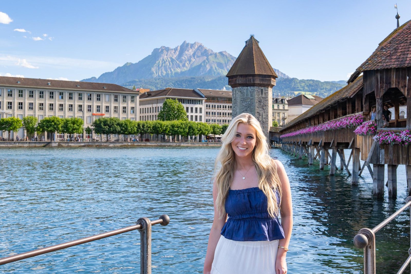 Traveler posing at the Lucerne lakefront promenade